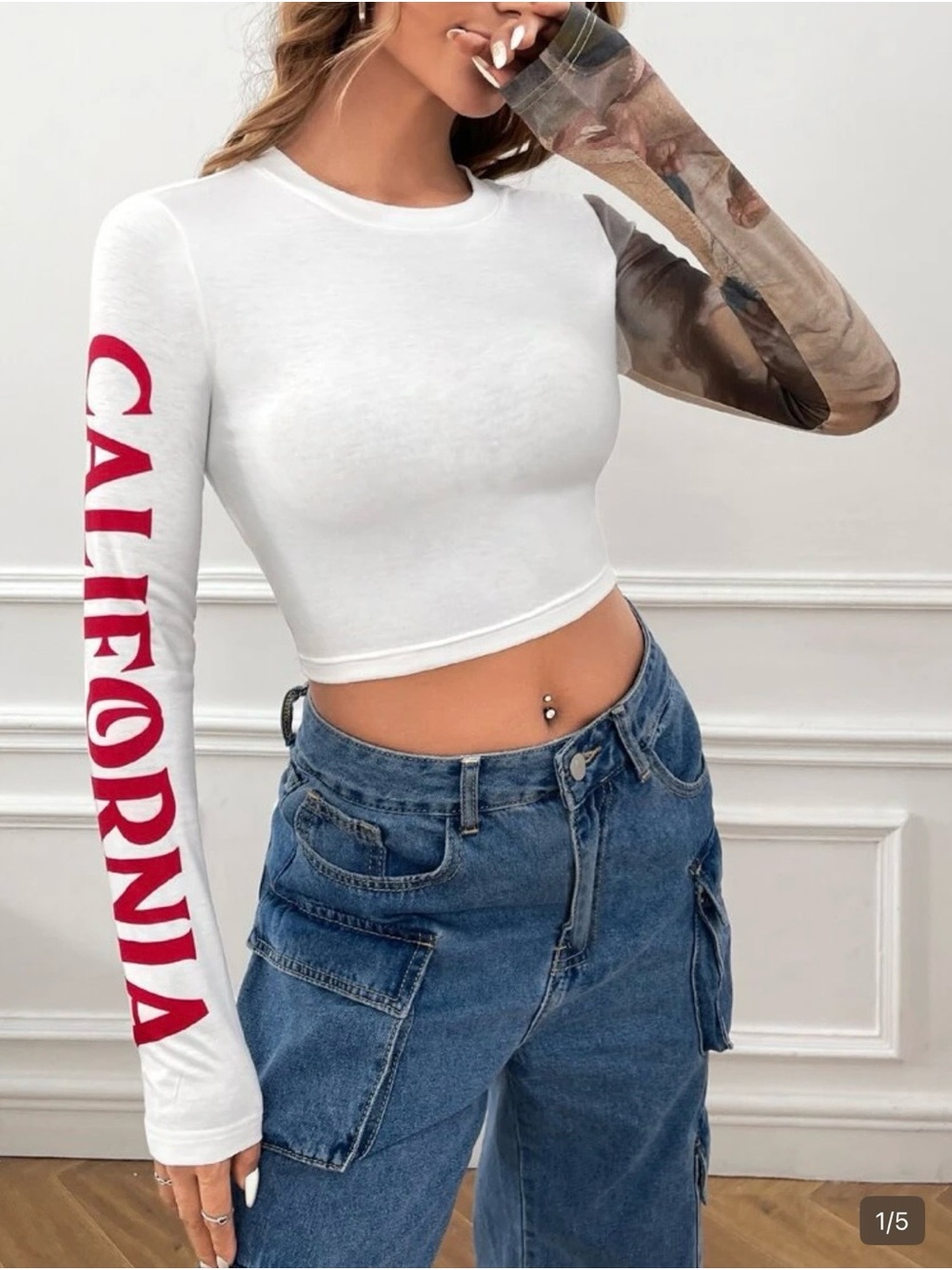 SHEIN White Crop Long Sleeve Top with Red Sleeve Script